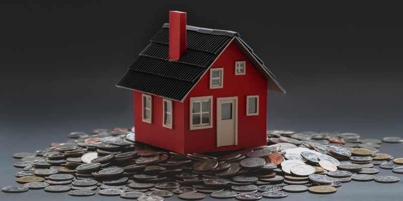 Modell eines Hauses auf Münzen